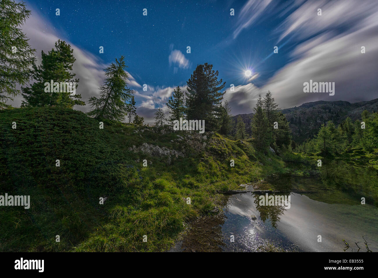 Lake Limedes by night with moon, Falzarego pass, Dolomites, Veneto, Italy Stock Photo