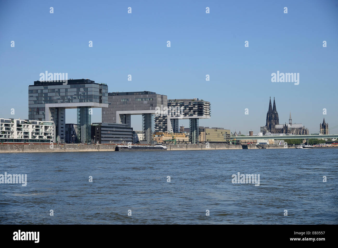 The three crane towers, Kranhaeuser, Cologne Cathedral at back, Cologne, Rhineland, North Rhine-Westphalia, Germany Stock Photo
