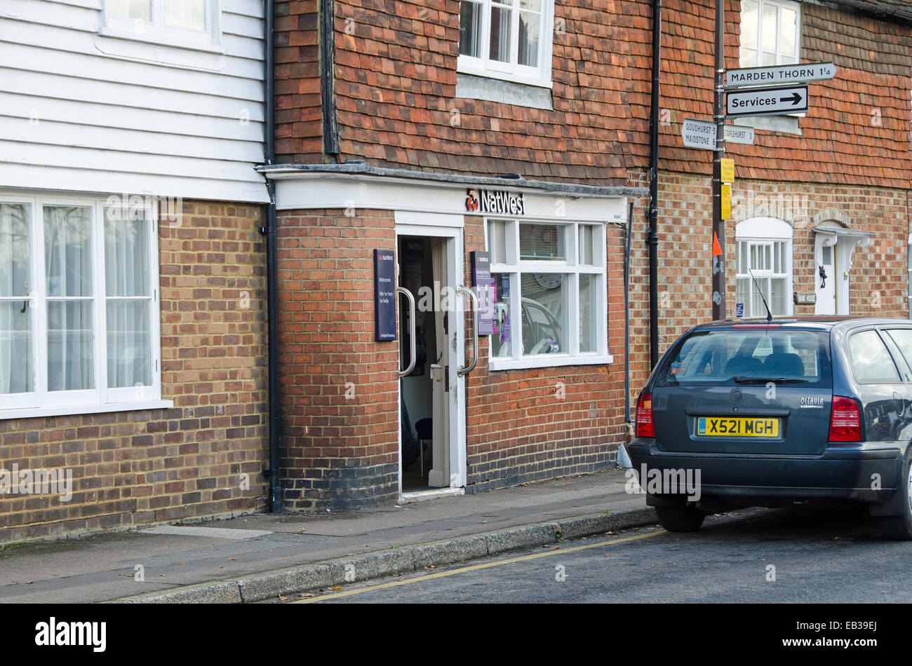 Kent, UK. 25th Nov, 2014. The Natwest Bank Banch in Marden, Kent is closing with effect today, 25 November2014.  This is one of a number of closures of branches in the Kent.  Natwest attribute the closure to an ongoing decline in the number of branch based transactions.  The branch is the last bank in the village.  Natwest confirm that some services can be accessed through the village post office. Credit:  Paul Martin/Alamy Live News Stock Photo