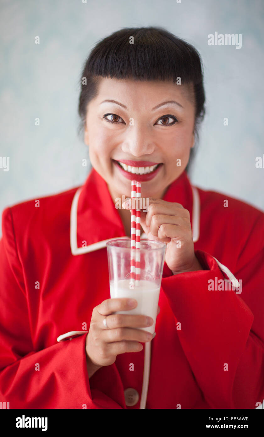 Woman drinking milk Stock Photo