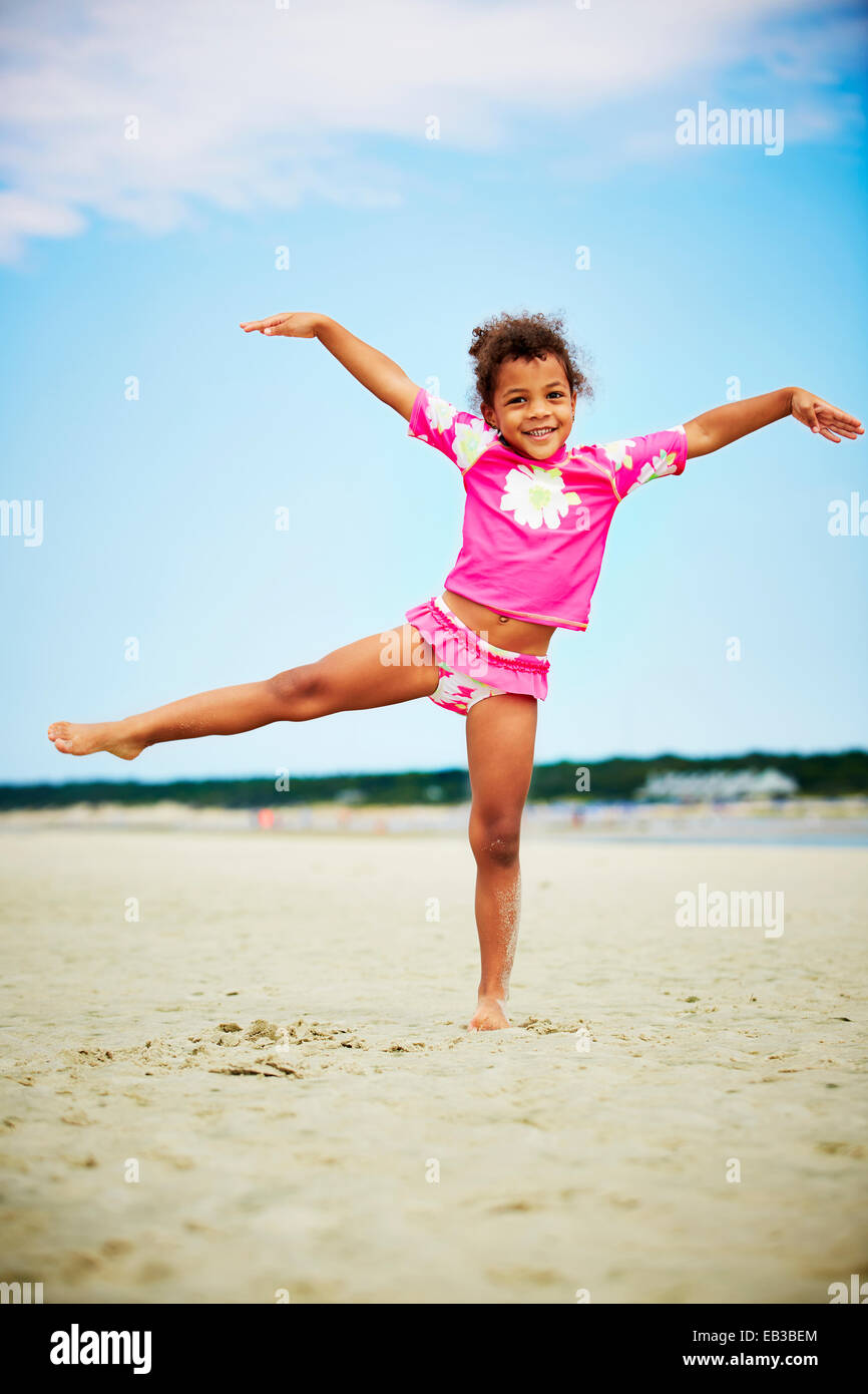 Mixed race girl posing on beach Stock Photo Alamy