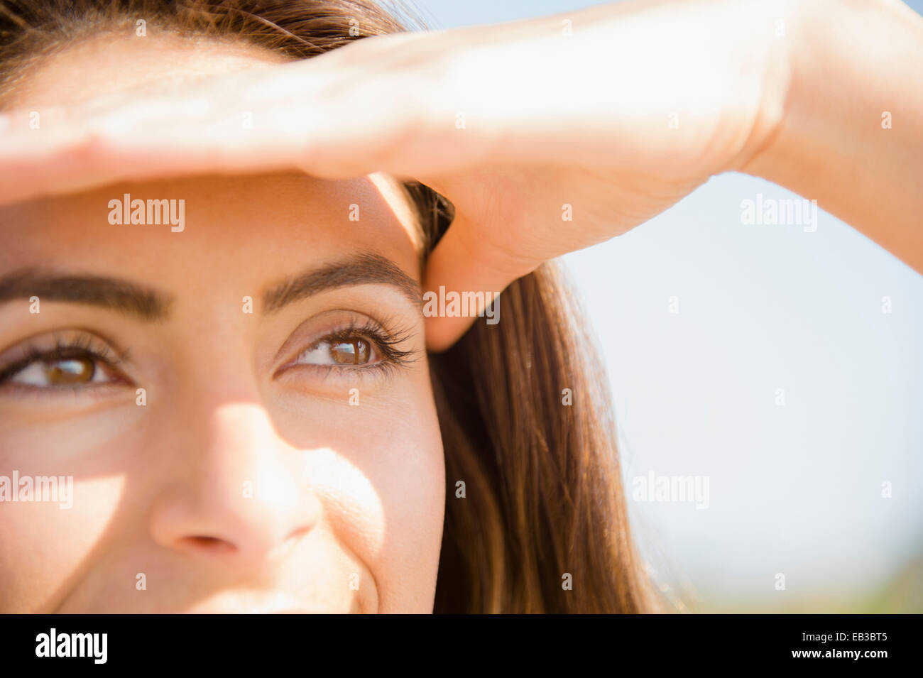 Covering eyes from sun hires stock photography and images Alamy