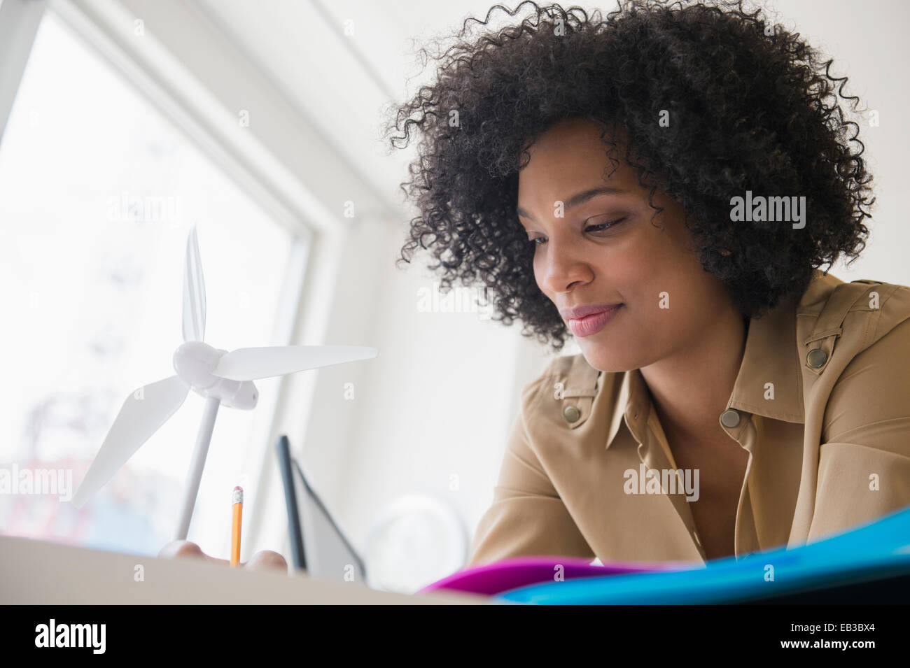 Low angle view of businesswoman working at desk Stock Photo