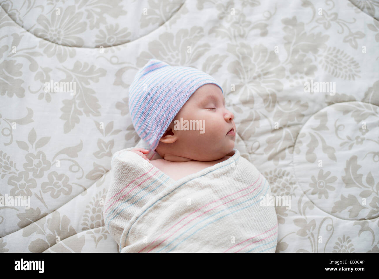 Sleeping newborn baby on bed hires stock photography and images Alamy