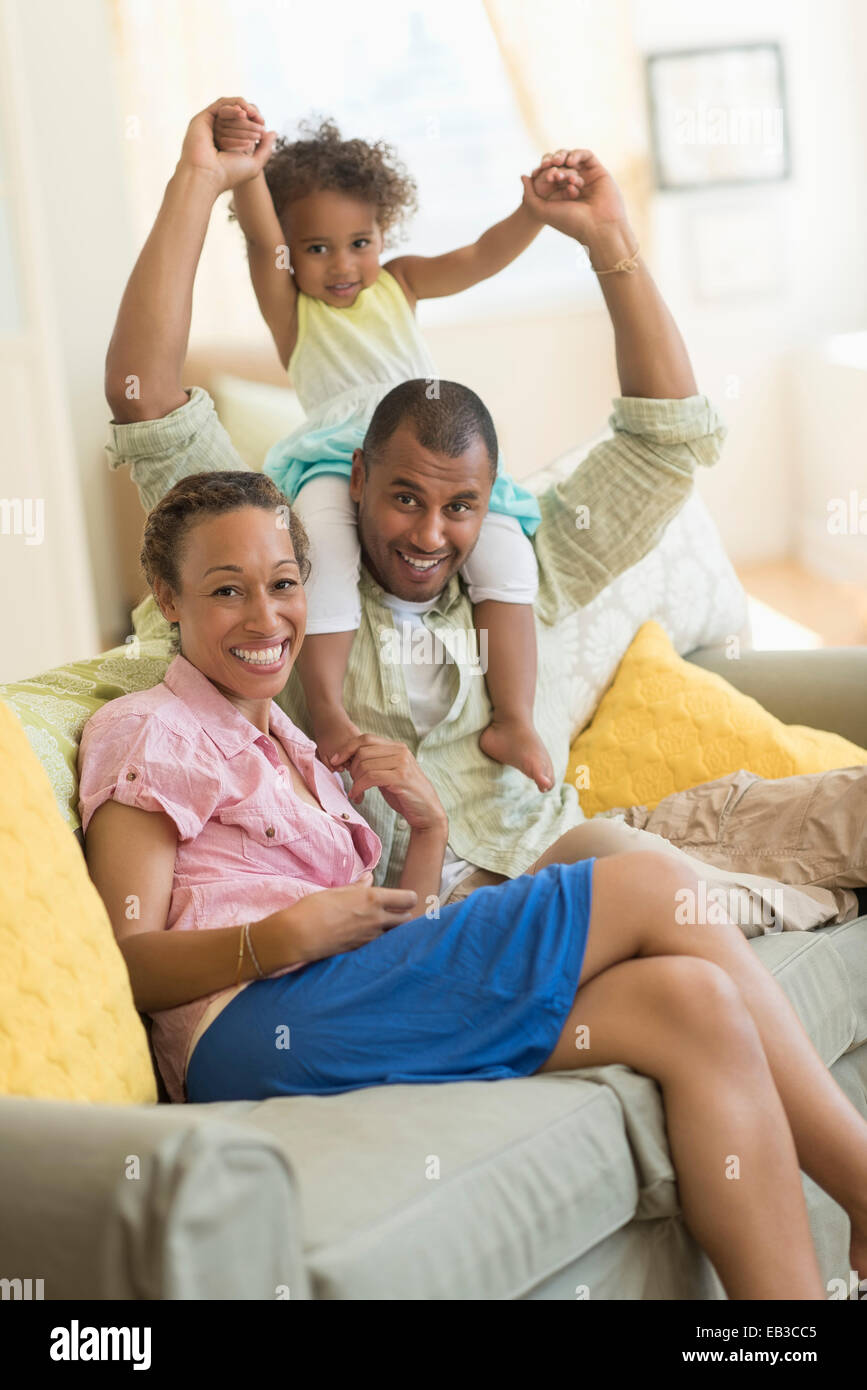Girl sitting barefoot on sofa hi-res stock photography and images - Alamy