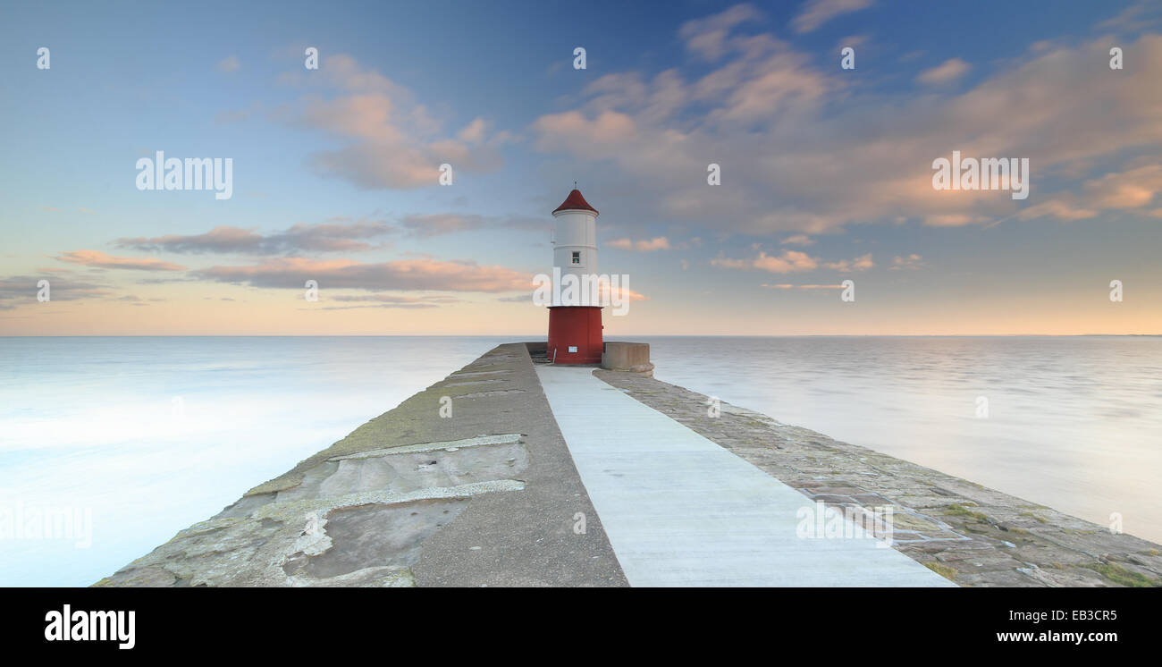 UK, England, North East England, Northumberland, Berwick Upon Tweed, View along footpath leading to lighthouse at end of pier Stock Photo