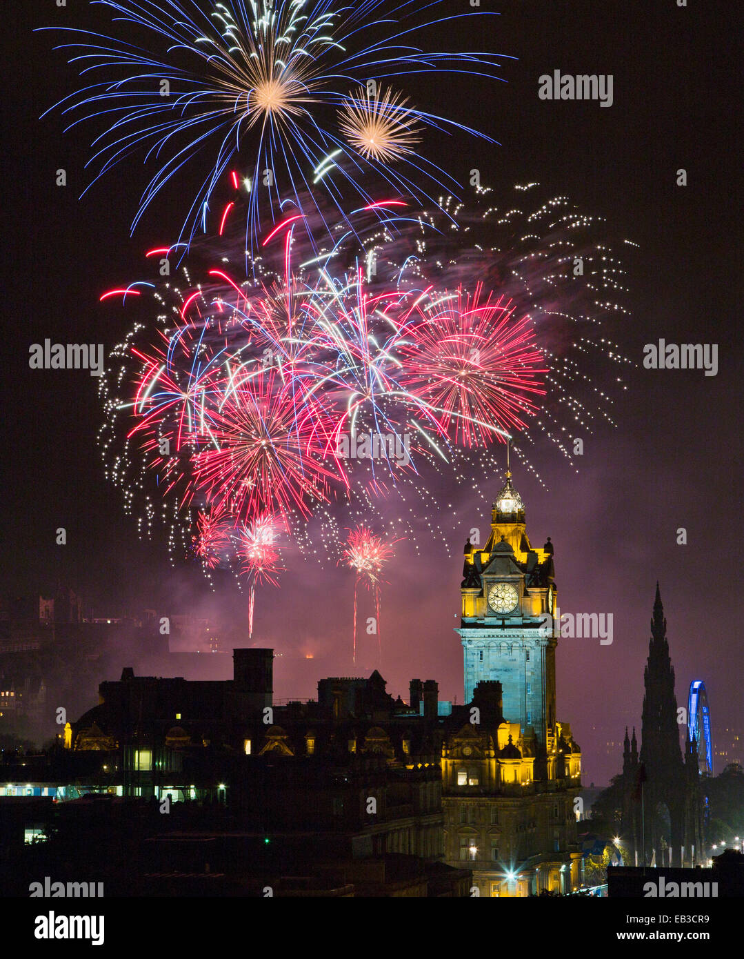 UK, Scotland, Edinburgh, Fireworks exploding above illuminated Stock