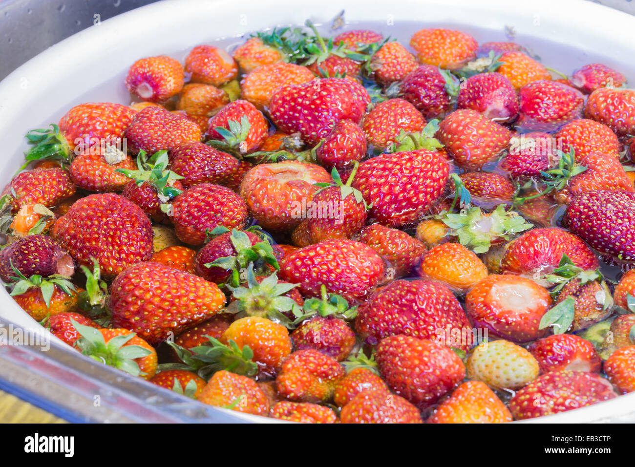 Strawberry jam cooking preparation strawberries washing Stock Photo - Alamy