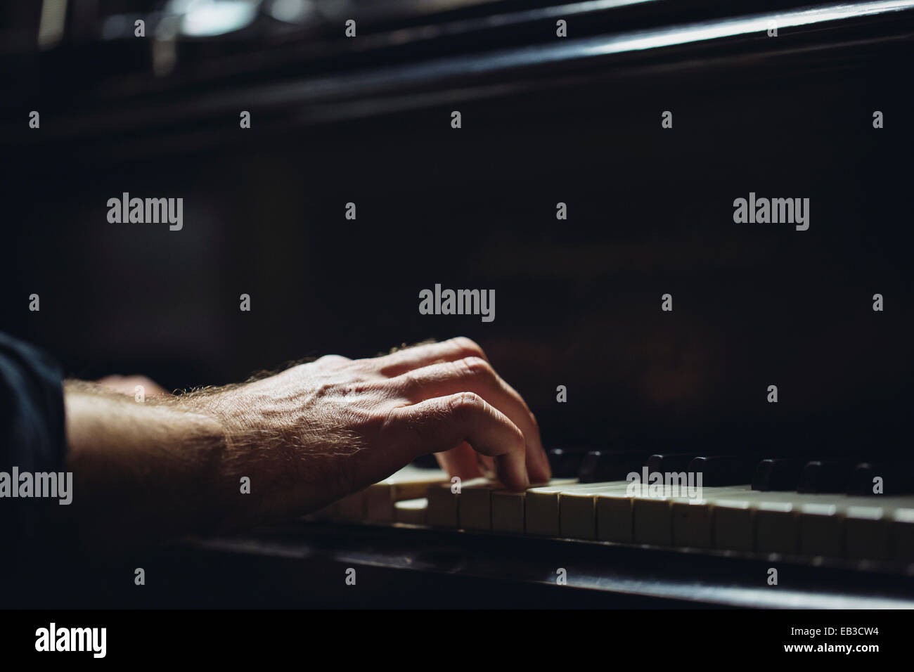 Close-Up of a man playing the piano Stock Photo