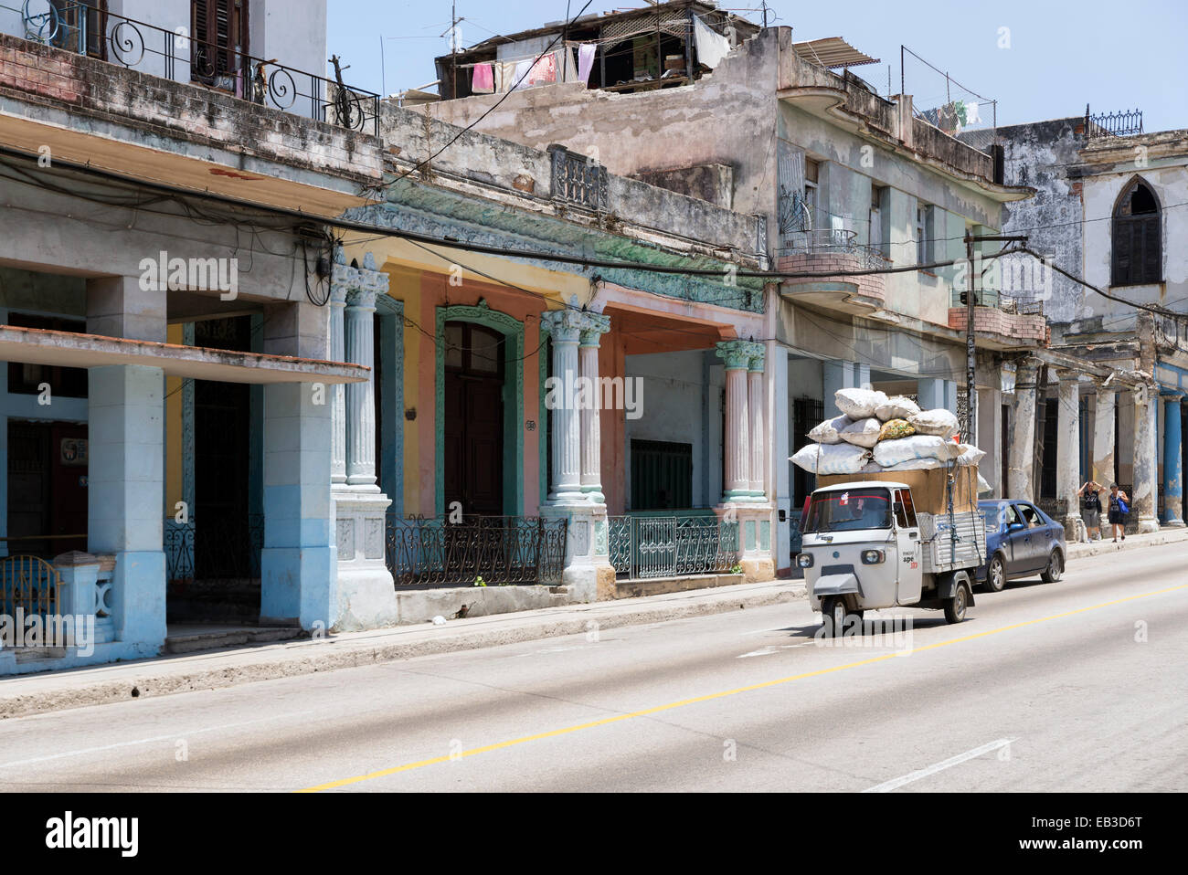 HAVANA, CUBA - MAY 5, 2014: Street scene with old van and worn out buildings. Stock Photo