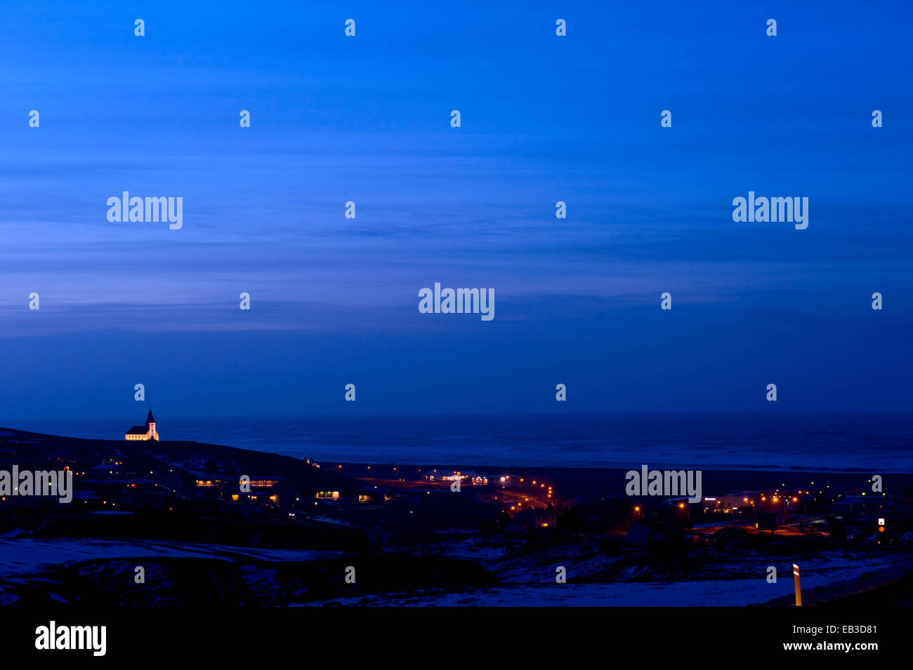 Vik cityscape illuminated at night, Sudhurland, Iceland Stock Photo