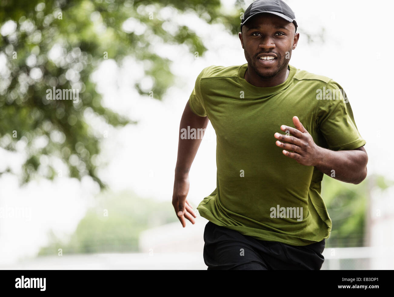 Black man running in park Stock Photo