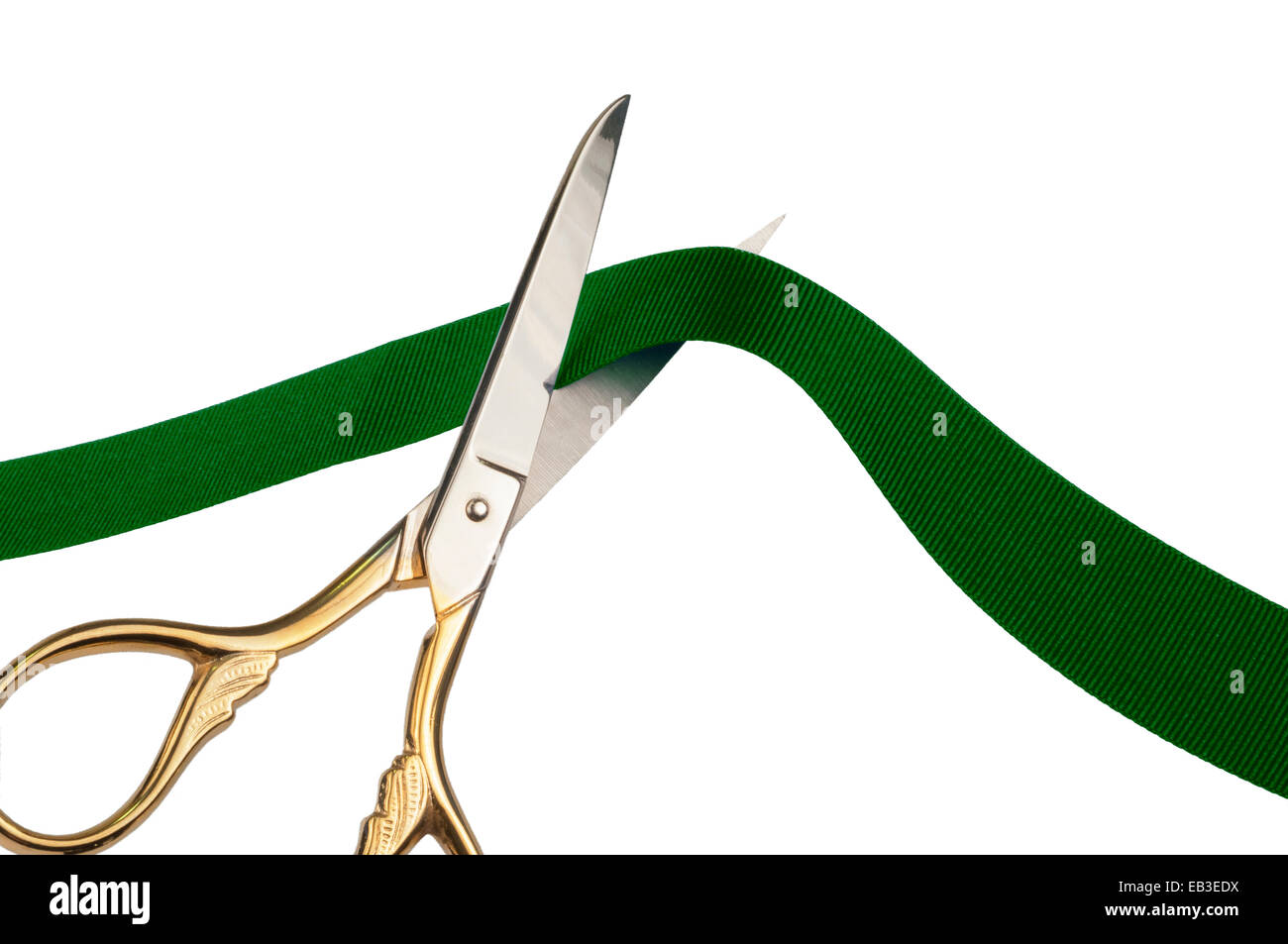 Scissors cutting a green ribbon Stock Photo Alamy