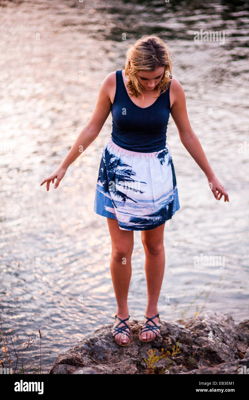 Girl standing on rock hi-res stock photography and images - Alamy