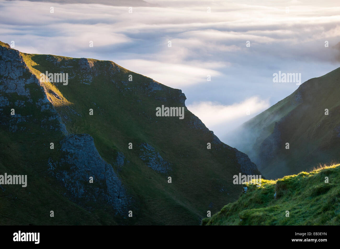 View looking down Winnats Pass to low cloud in the Hope valley and Castleton, Derbyshire. Stock Photo
