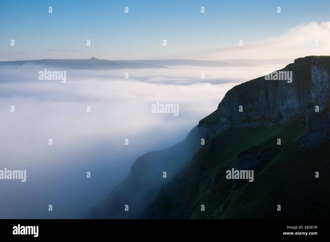 Dreamlike mist drifting around Winnats Pass in the Peak District, Derbyshire. View to Win Hill in the distance. Stock Photo