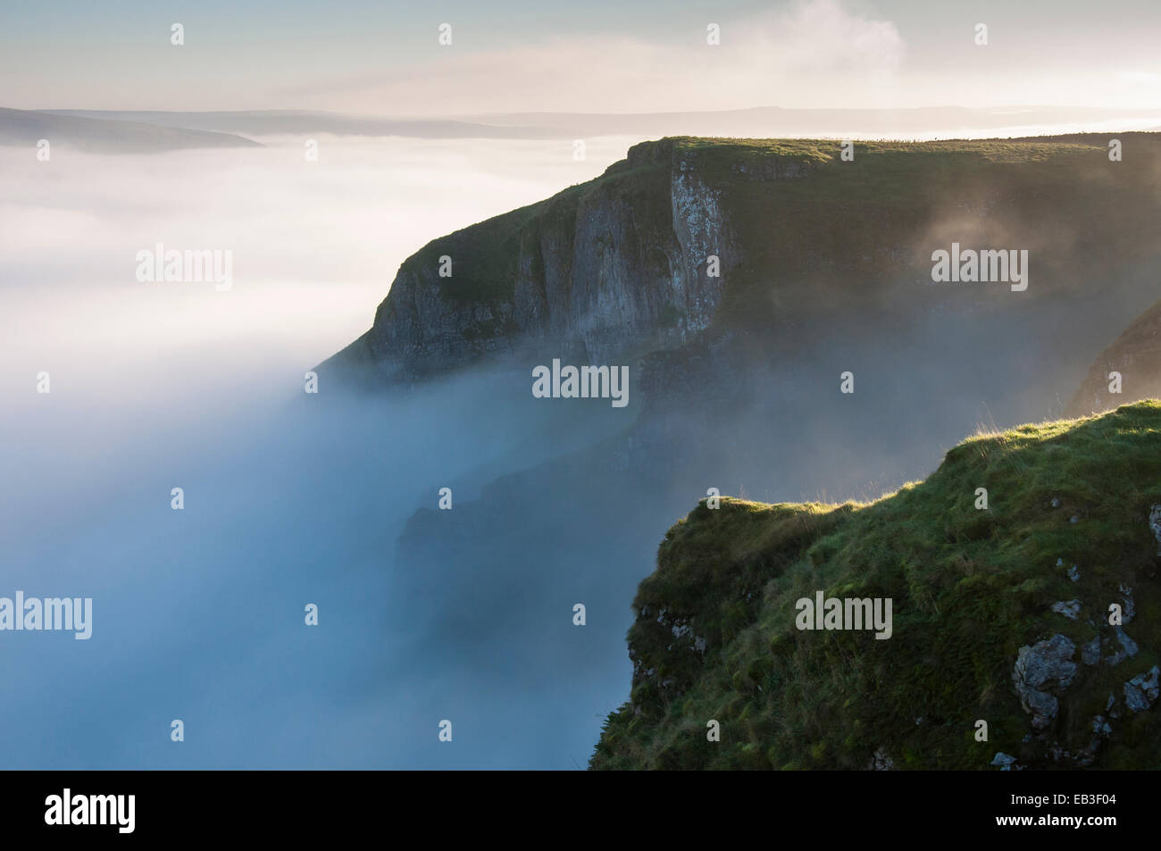 Dreamlike mist drifting around Winnats Pass in the Peak District, Derbyshire. Stock Photo