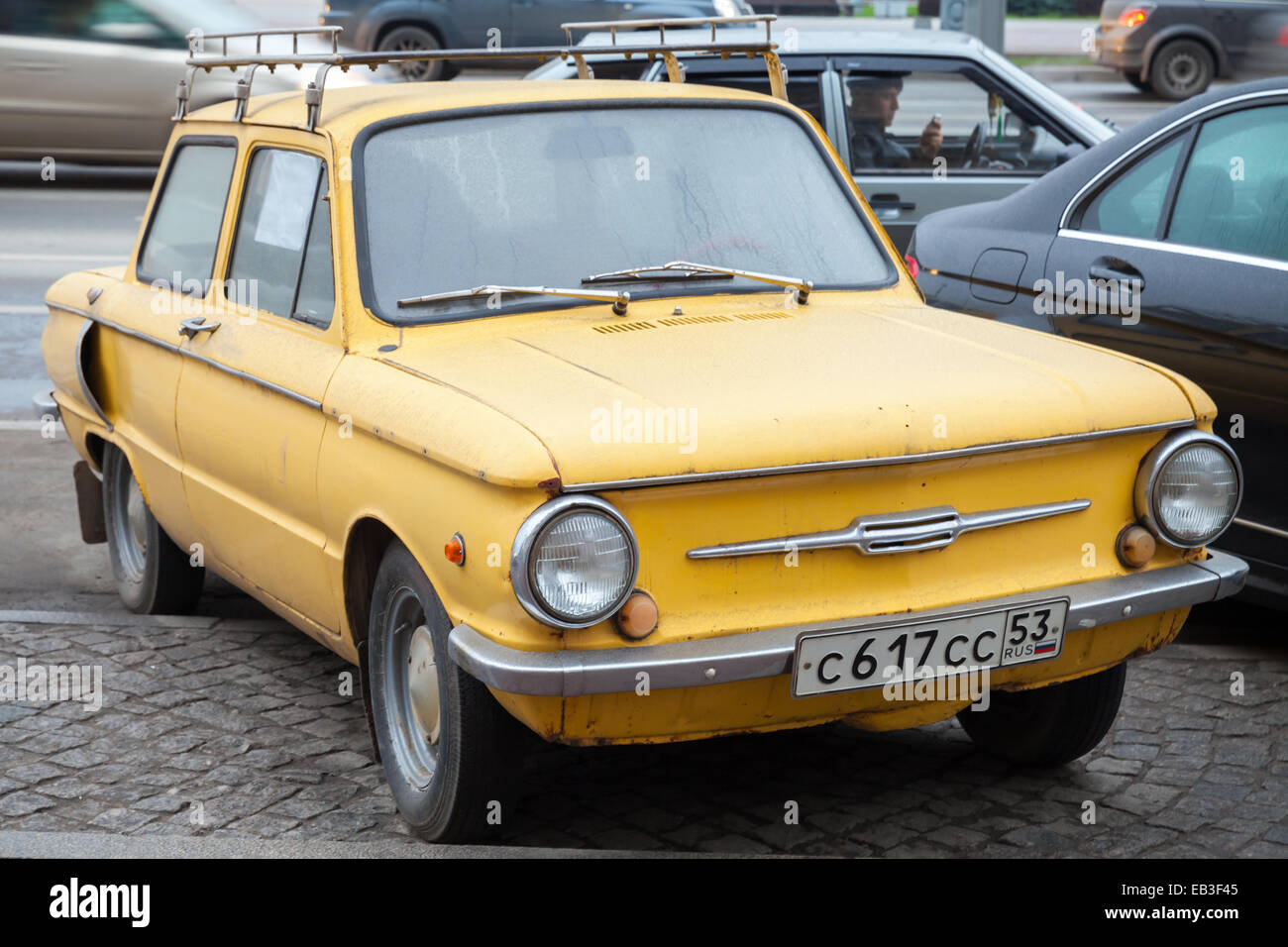 Saint-Petersburg, Russia - November 15, 2014: old yellow soviet Zaz 968 car stands parked on the roadside Stock Photo