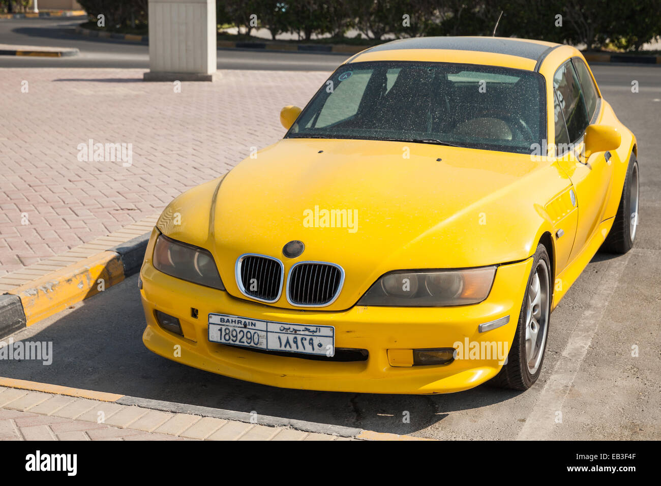 Manama, Bahrain - November 21, 2014: Yellow BMW Z3 M Coupe car is parked on the roadside in Manama Stock Photo