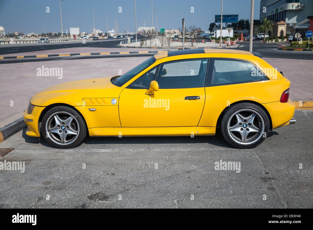 Manama, Bahrain - November 21, 2014: Yellow BMW Z3 M Coupe car stands parked on the roadside in Manama Stock Photo