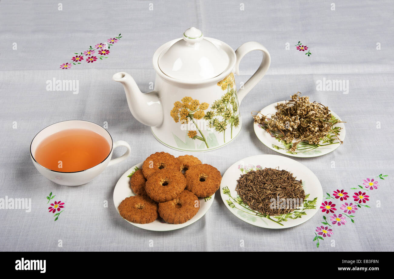 Cup of tea with cookies and tea pot Stock Photo