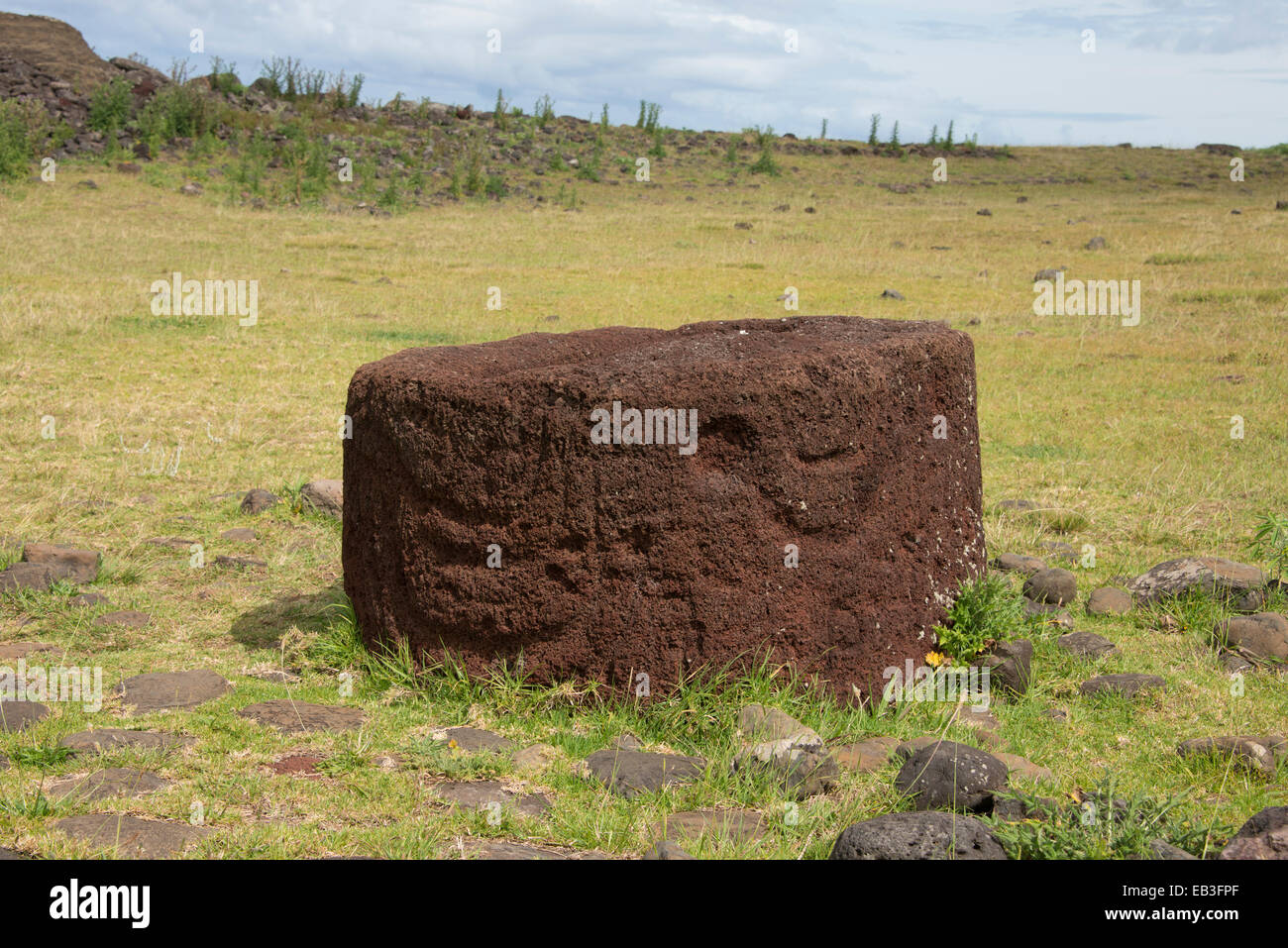 Chile, Easter Island aka Rapa Nui, Rapa Nui NP. Ahu Vinapu, important ceremonial center. Red volcanic scoria stone pukao. Stock Photo
