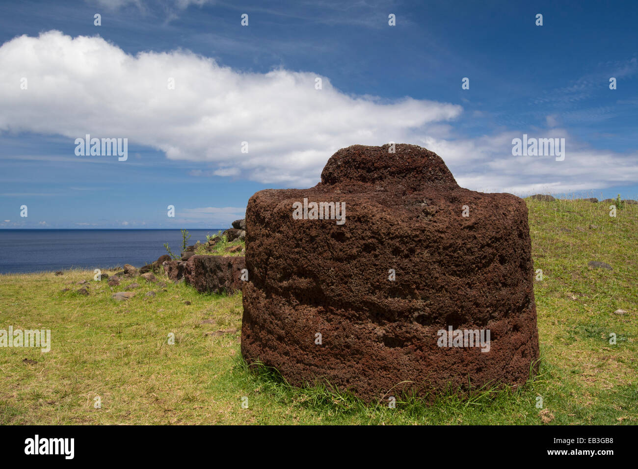 Chile, Easter Island aka Rapa Nui, Rapa Nui NP. Ahu Vinapu, important ceremonial center. Red volcanic scoria stone carved hat Stock Photo