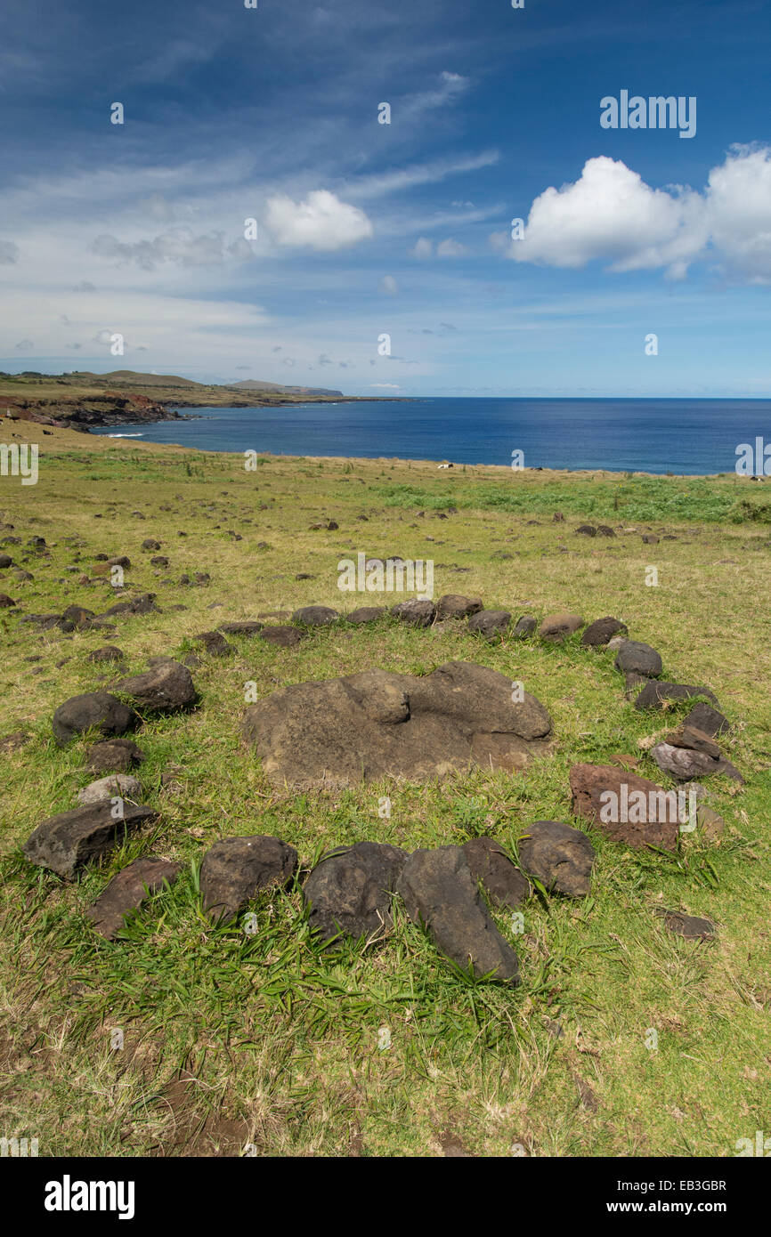 Chile, Easter Island aka Rapa Nui, Rapa Nui NP. Ahu Vinapu, important ceremonial center, stone moi head. Stock Photo