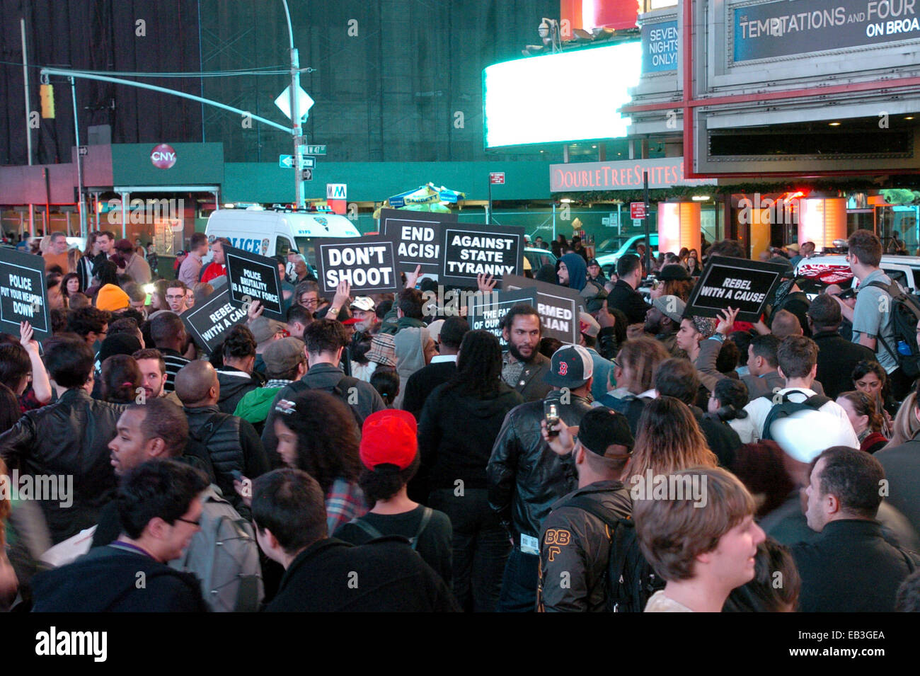 New York, USA. 24th Nov, 2014. Protesters march at Times Square in New York, the United States, on Nov. 24, 2014. A demonstration was held in New York after the announcement that police officer Darren Wilson would not be indicted for the shooting unarmed 18-year-old Michael Brown in Ferguson on August. © David Torres/Xinhua/Alamy Live News Stock Photo