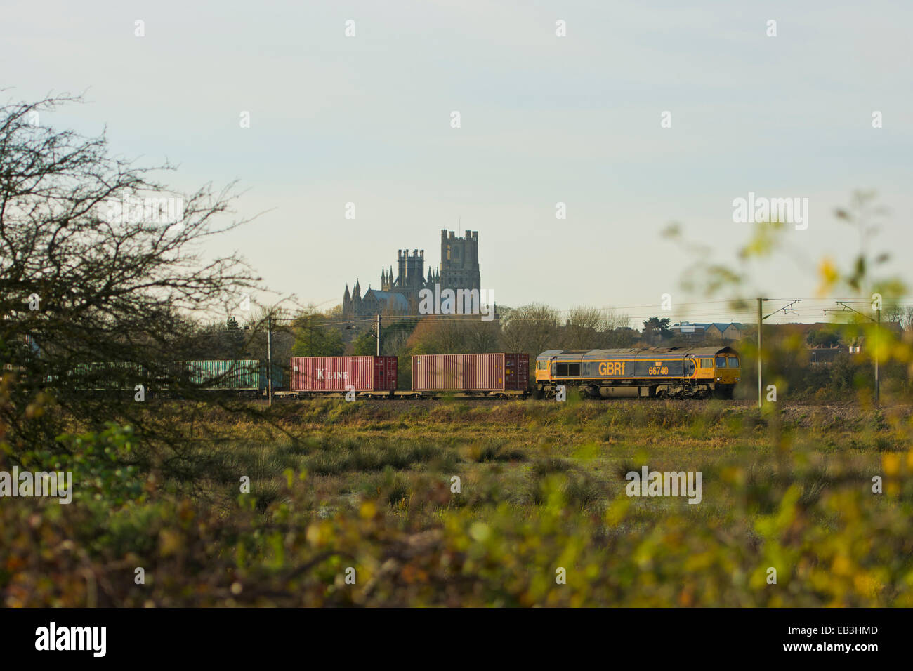 GBRf freight container train passing Ely Cathedral Stock Photo