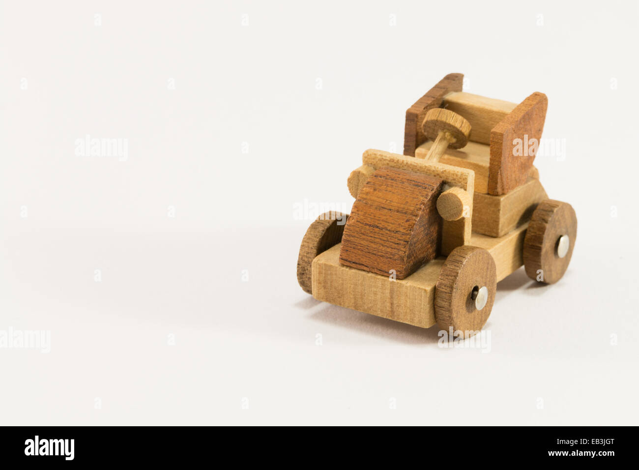 Wooden toy old car miniature on white background Stock Photo - Alamy