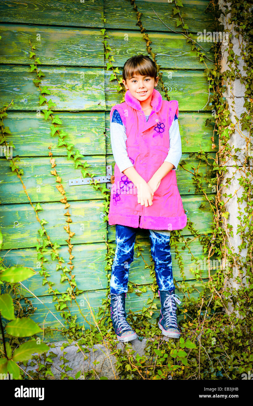 Little girl standing in front of the doors Stock Photo - Alamy
