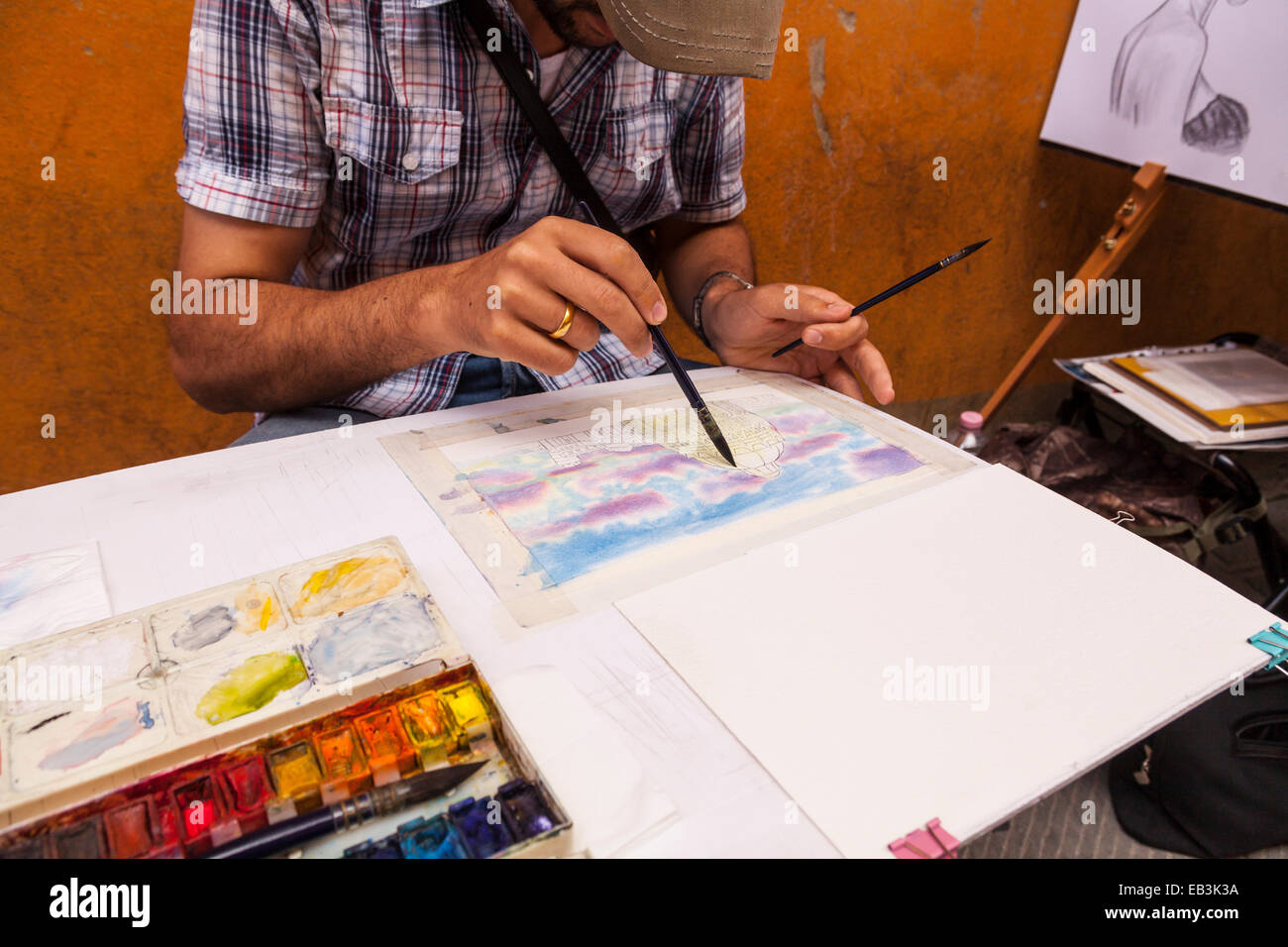 A street artist draws Pisa cathedral. Stock Photo
