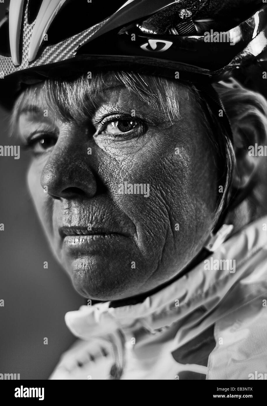 White European female age 50 wearing cycling equipment Stock Photo