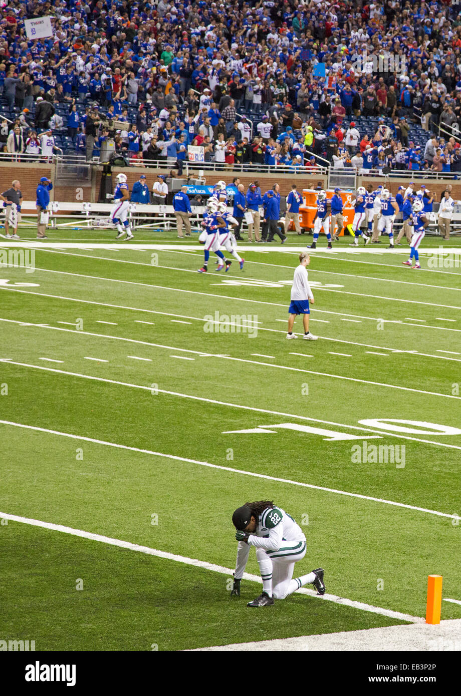 Detroit, Michigan - A member of the New York Jets prays before a National Football League game at Ford Field. Stock Photo