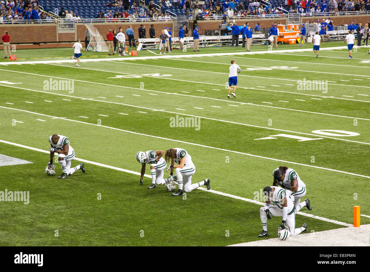 Detroit, Michigan - A member of the New York Jets prays before a National Football League game at Ford Field. Stock Photo