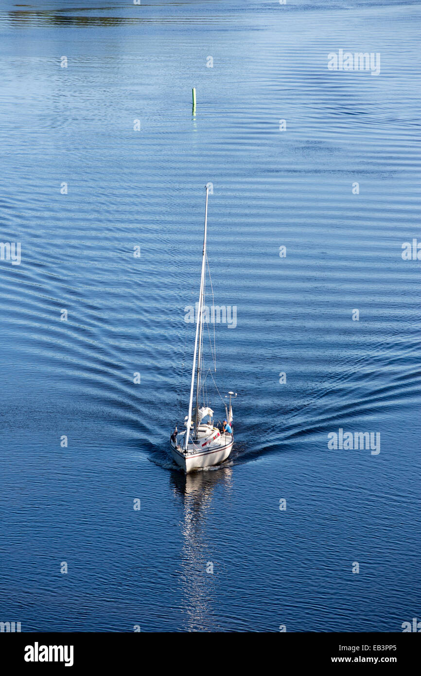 Aerial view of a sailboat driving with motor at inland river , Leppävirta , Finland Stock Photo