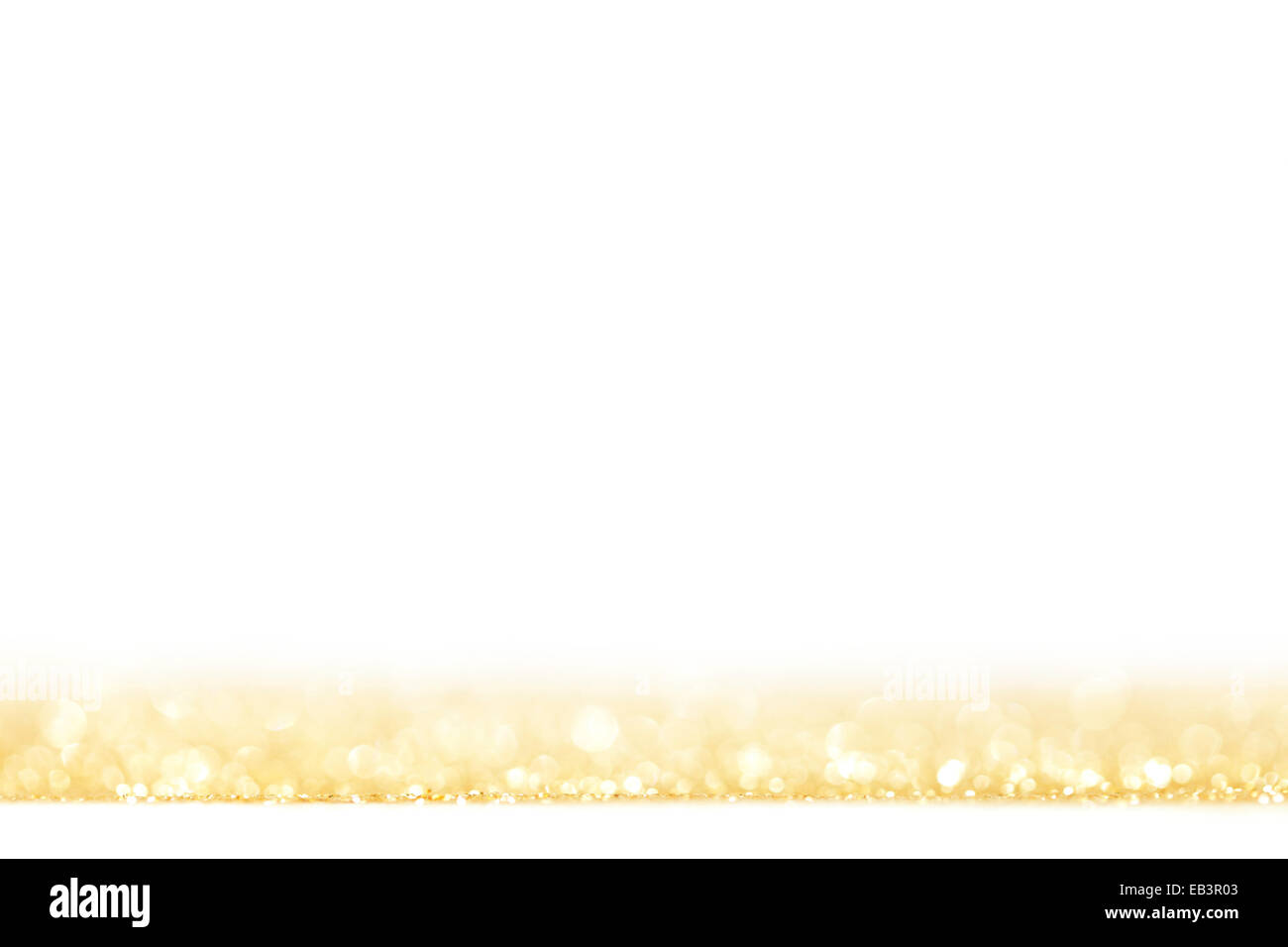 Golden festive glitter background with defocused lights Stock Photo