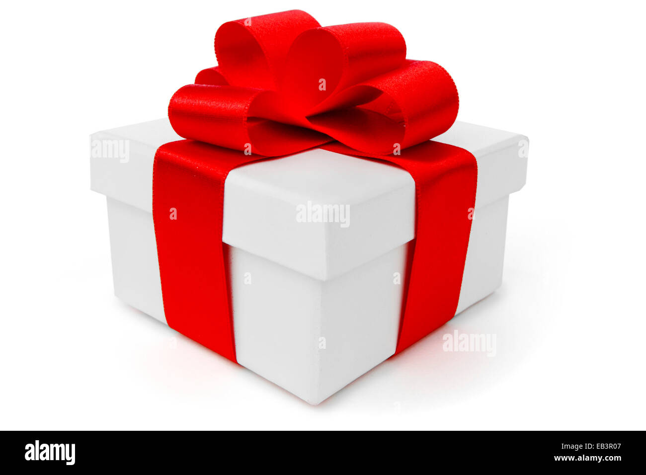 White gift box with red ribbon bow isolated on white background close ...