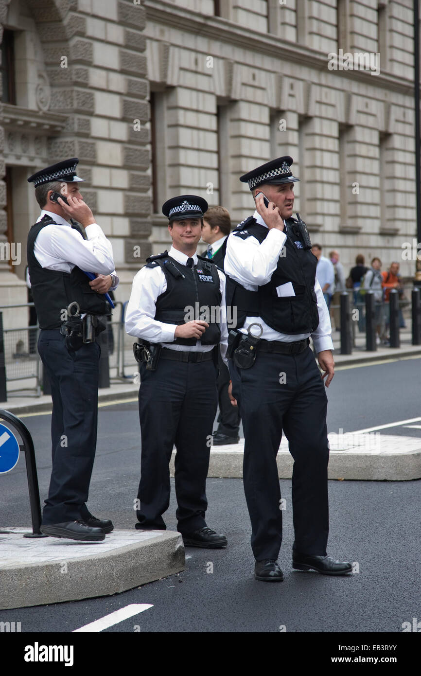 Metropolitan Police officers in the Whitehall area of London, England, UK Stock Photo