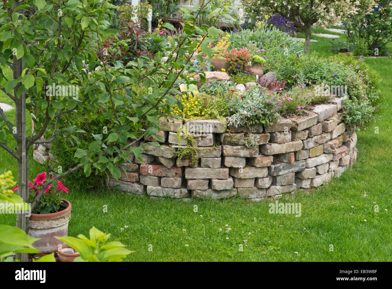 Raised bed made of bricks Stock Photo Alamy