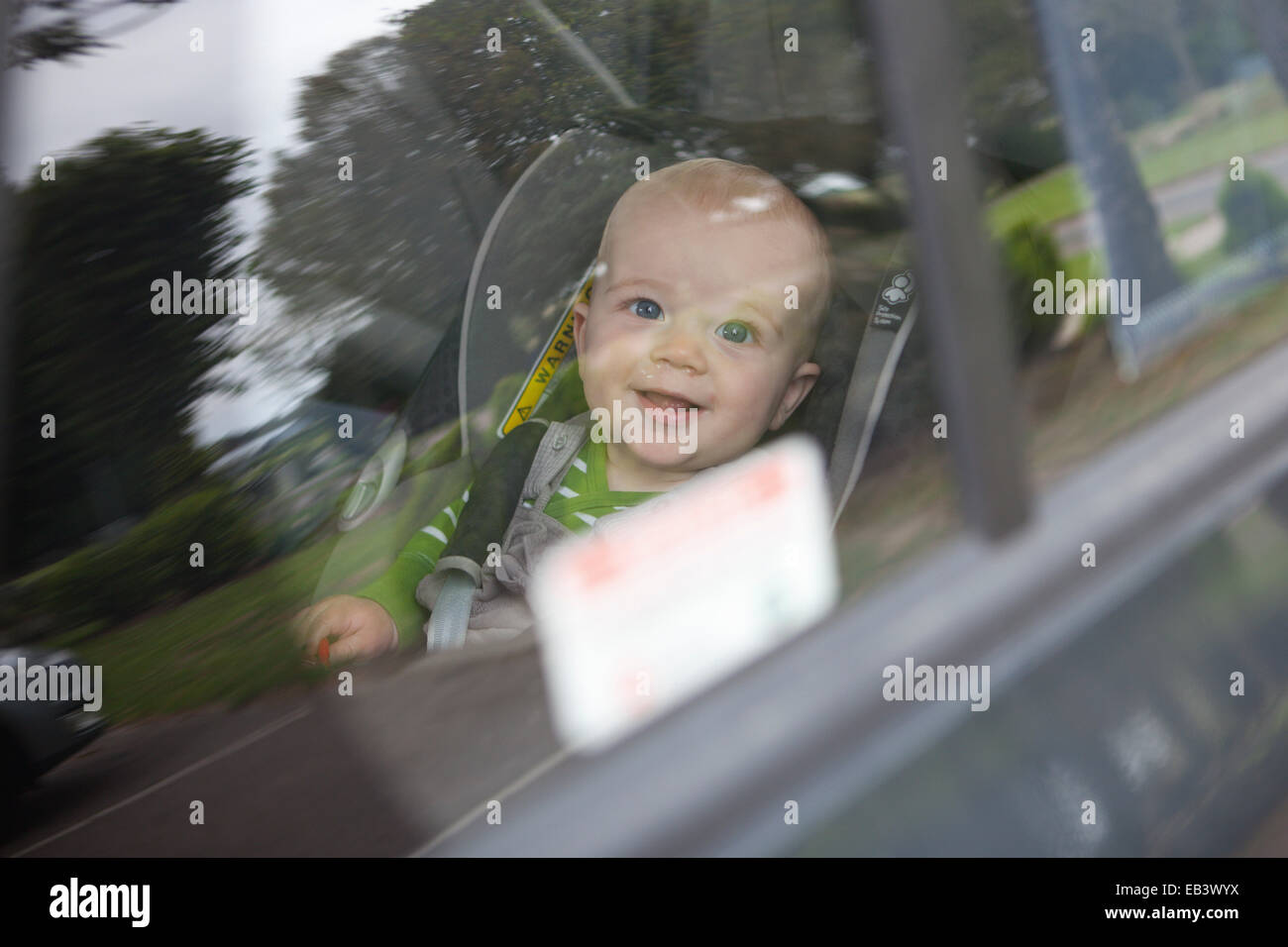 Baby Boy Looking Out Through Car Window Stock Photo Alamy