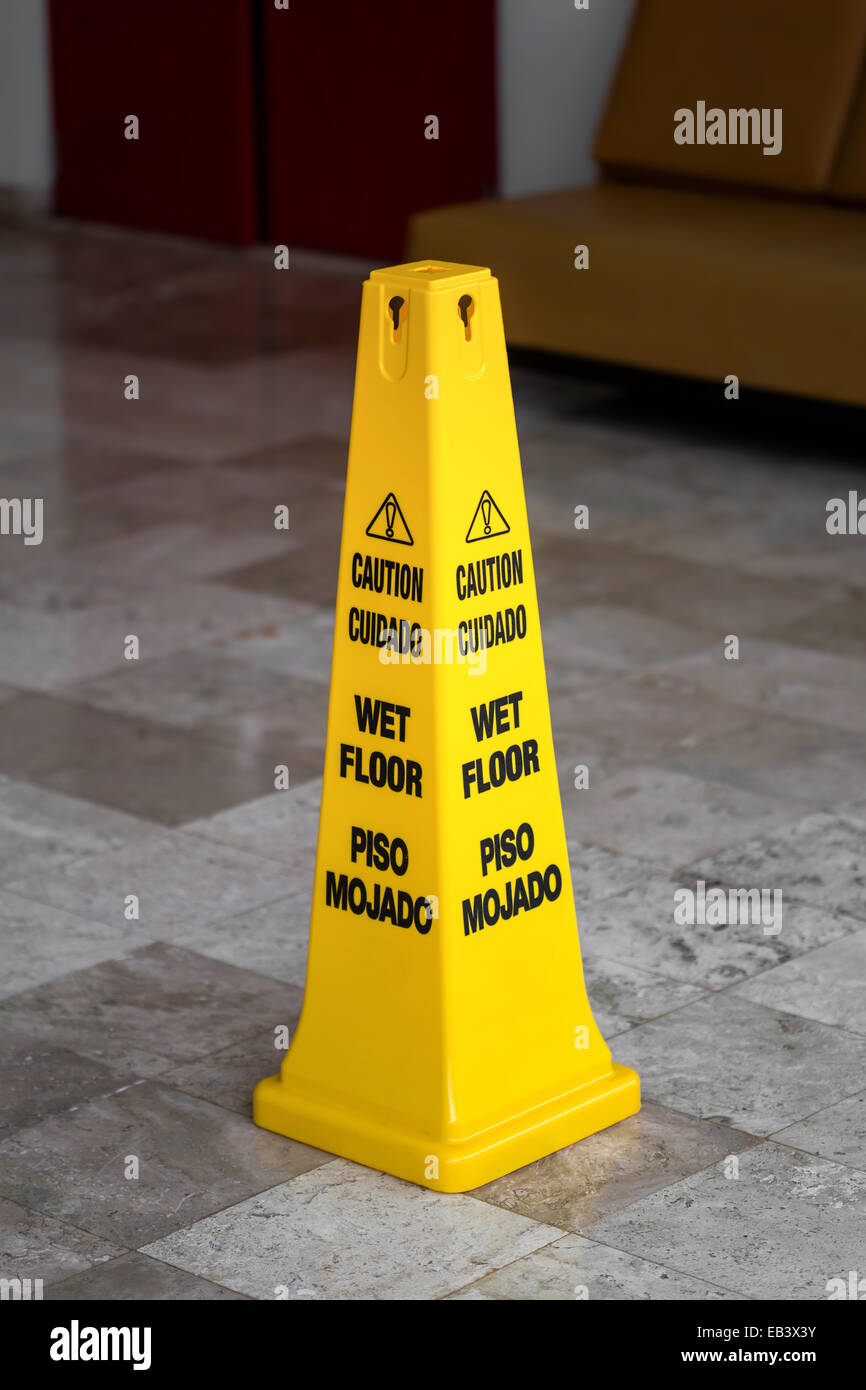 Lobby floor with caution wet floor sign Stock Photo