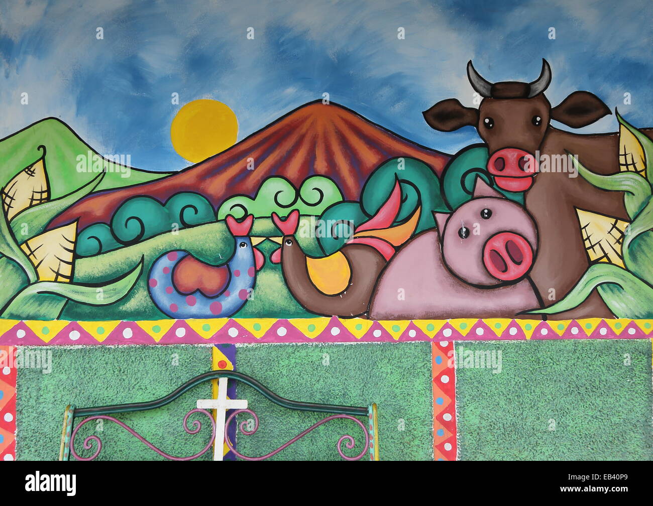 A brightly coloured mural painted on the walls of a street in Ataco, a small town in the Ahuachapán region of El Salvador. Stock Photo