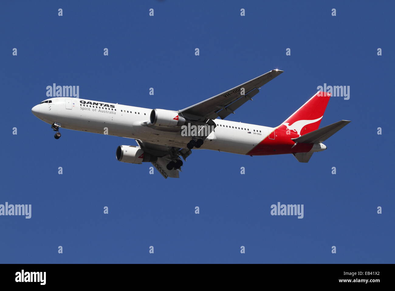 A QANTAS Boeing 767 named 'Byron Bay' arriving at Sydney Airport, Sydney,  Australia. Stock Photo