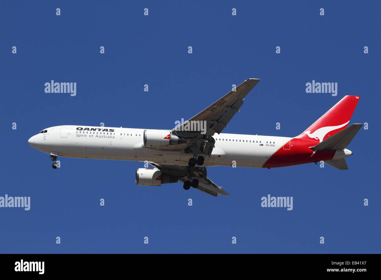 A QANTAS Boeing 767 named 'Byron Bay' arriving at Sydney Airport in Sydney, Australia. Stock Photo