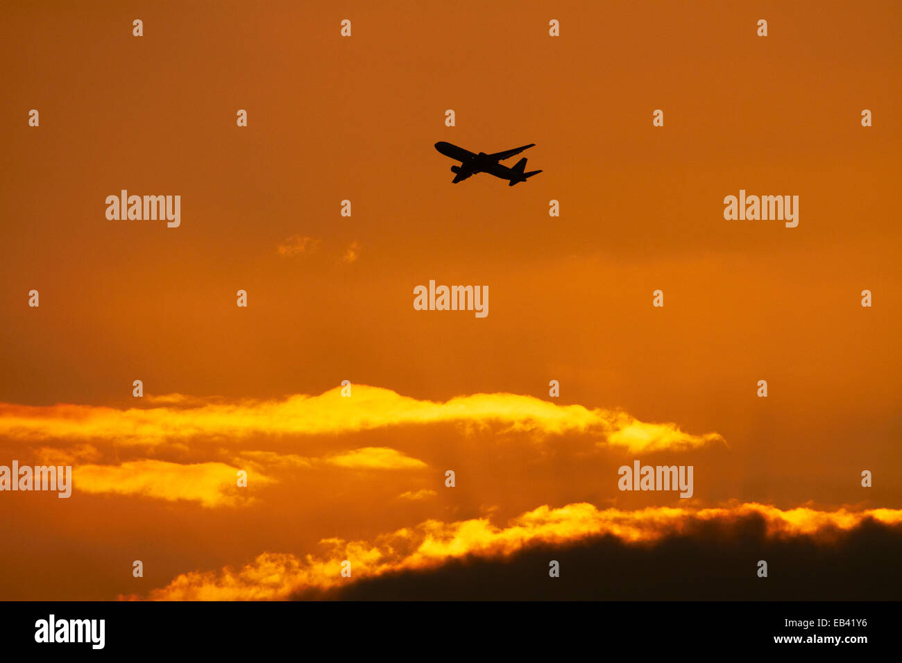 Passenger jet at sunset, Honolulu, Oahu, Hawaii, USA Stock Photo