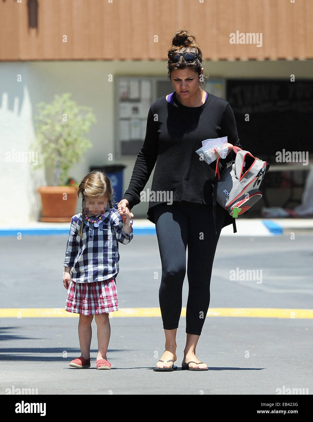 Tiffani Thiessen, of 'Saved by the Bell' fame, was spotted without makeup as she picked up her daughter Harper from school  Featuring: Tiffani Amber Thiessen,Tiffani Thiessen,Harper Smith Where: Los Angeles, California, United States When: 24 May 2014 Stock Photo