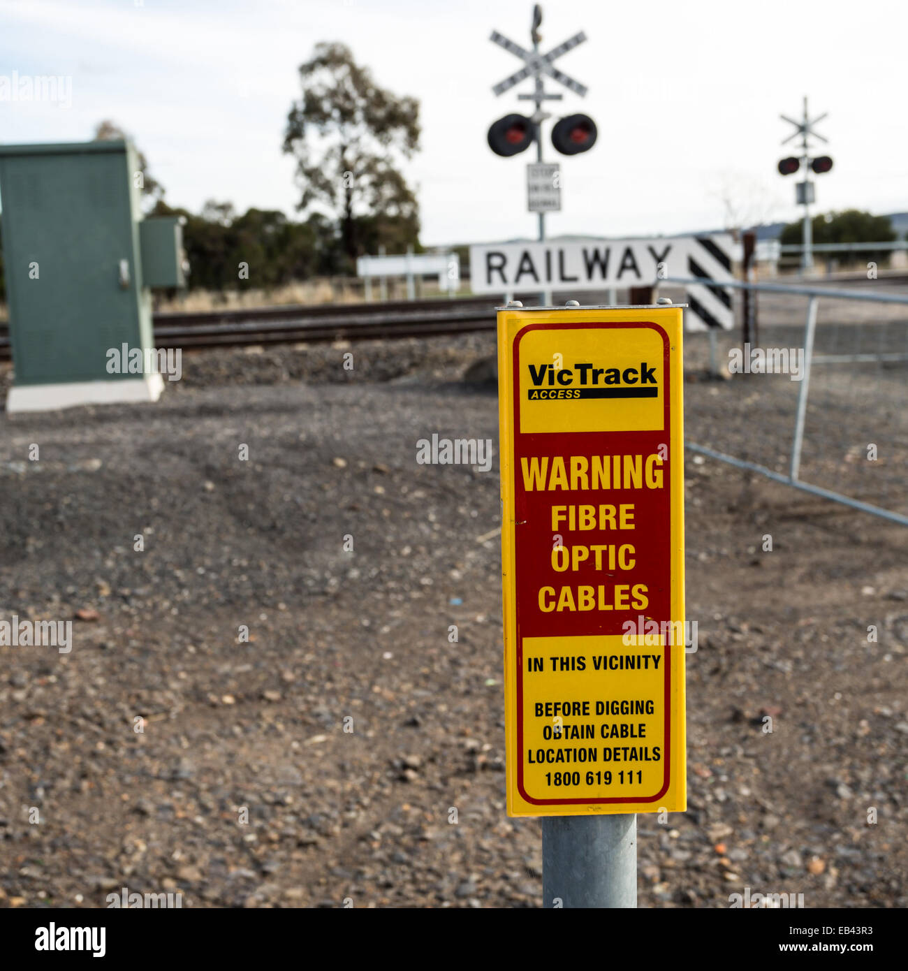 Fibre optic warning sign at railway crossing Stock Photo