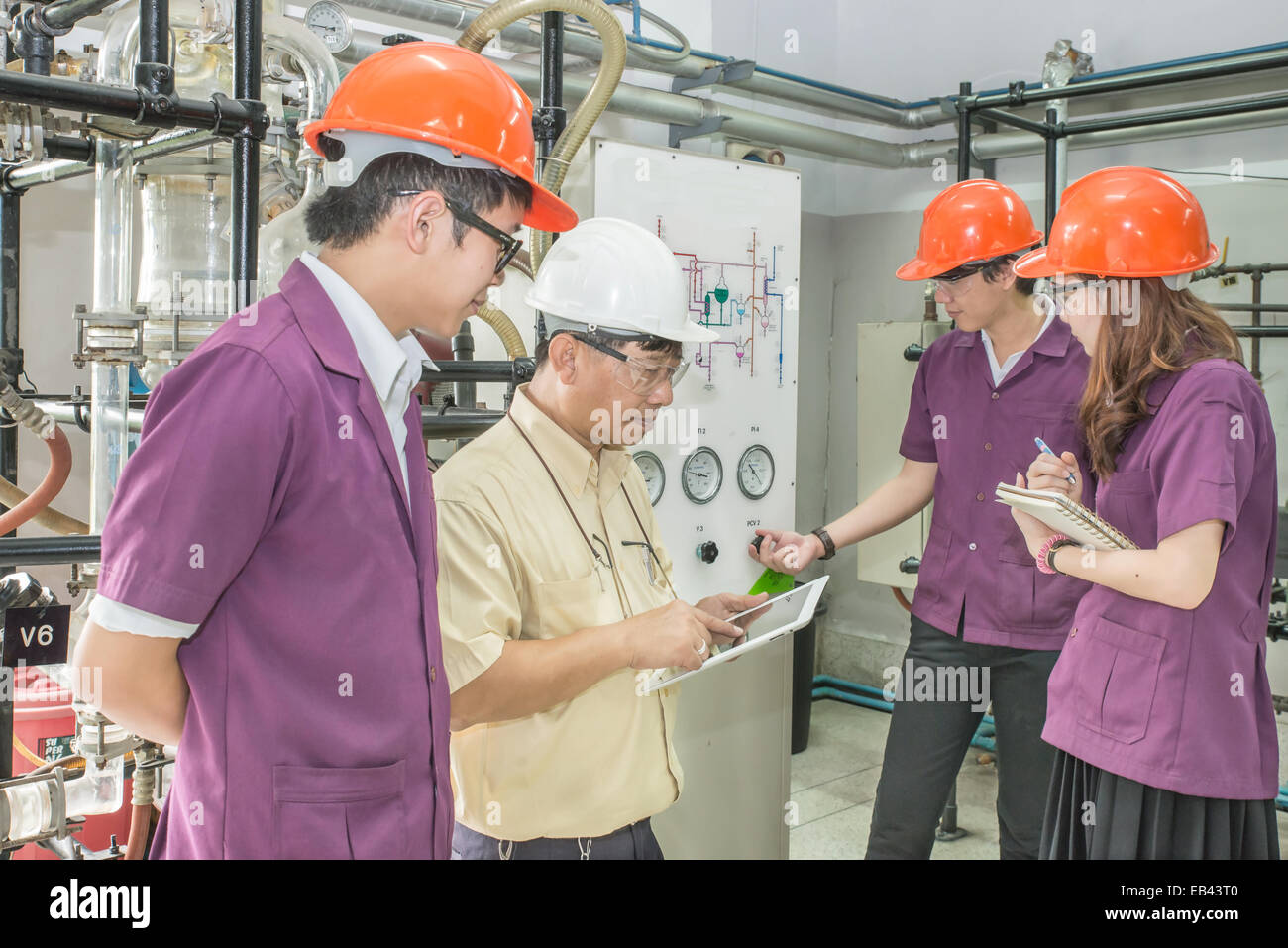 Engineering professional with group of students in training Stock Photo